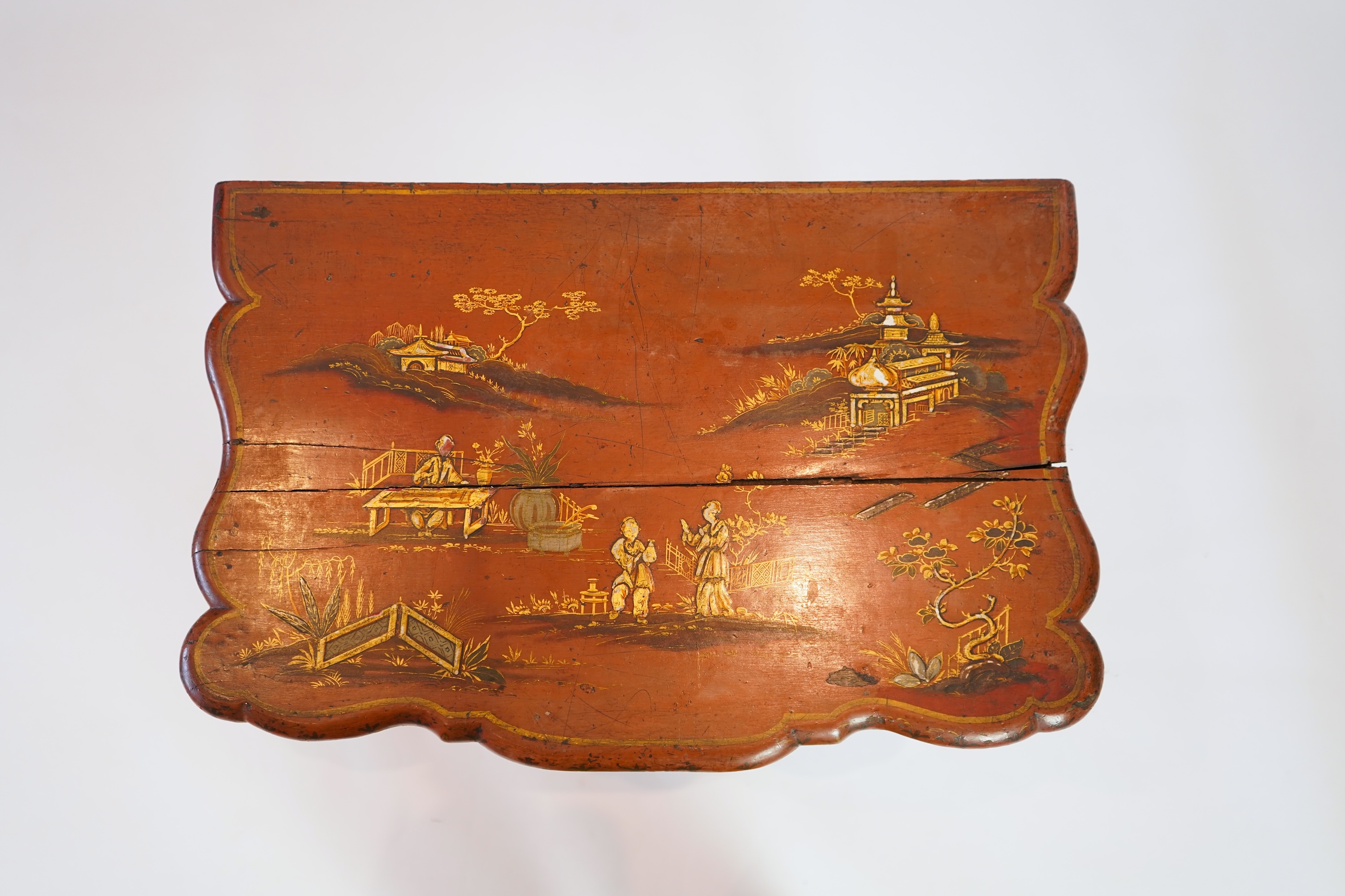An early 18th century scarlet japanned lowboy